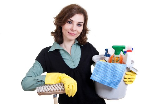 Cleaner inspecting detergent handling and work area hazards